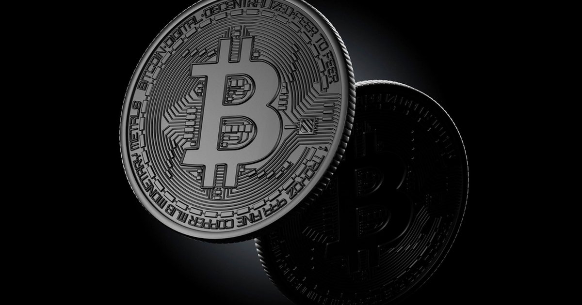 Two bitcoin coins on a black background: with a crypto demo account you learn to handle very volatile markets